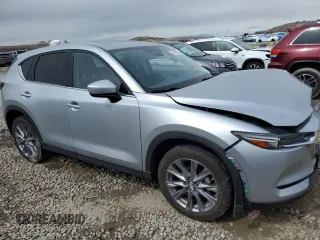 2021 Mazda CX-5 Grand Touring with VIN JM3KFBDM1M1403699, listed as a Copart auction lot 49888655 with 29,919 mi miles and Salvage Title. Bid and sale history available at carsss.com. Image 4.