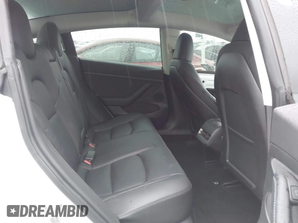 2023 Tesla Model 3 with VIN 5YJ3E1EA8PF578199, listed as a IAAI auction lot 41735465 with 50,823 mi miles and . Bid and sale history available at DreamBid. Image 8.