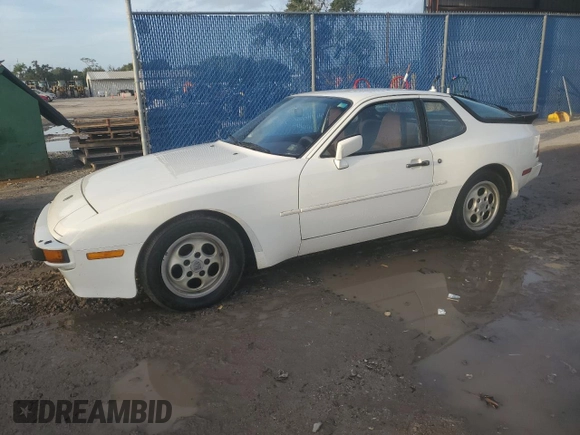 1987 Porsche 944 z VIN WP0AB0948HN473051, wystawiony jako Copart lot #73666654 z przebiegiem 82 580 mil mil oraz Szkoda całkowita • Salvage title. Historia ofert i sprzedaży dostępna na DreamBid. Obrazek 1.