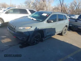 2015 Jeep Cherokee Trailhawk with VIN 1C4PJMBS3FW510219, listed as a IAAI auction lot 41440297 with 144,012 mi miles and . Bid and sale history available at DreamBid. Image 2.