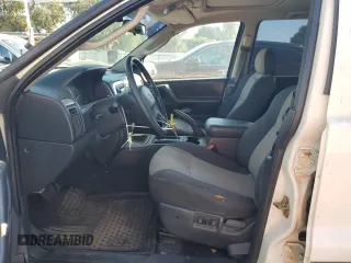2004 Jeep Grand Cherokee with VIN 1J4GX48JX4C301369, listed as a Copart auction lot 77803094 with 179,404 mi miles and Clean title. Bid and sale history available at DreamBid. Image 7.