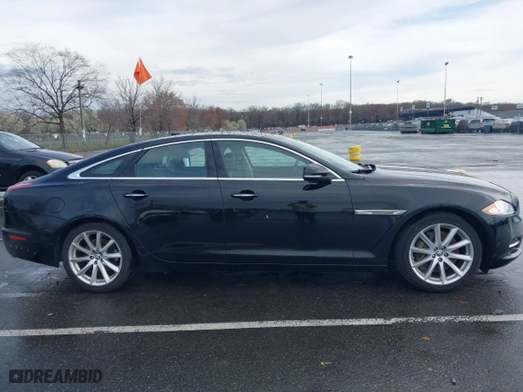 2011 Jaguar XJ with VIN SAJWA1CB8BLV12389, listed as a IAAI auction lot 41957217 with 51,585 mi miles. Bid and sale history available at carsss.com. Image 13.