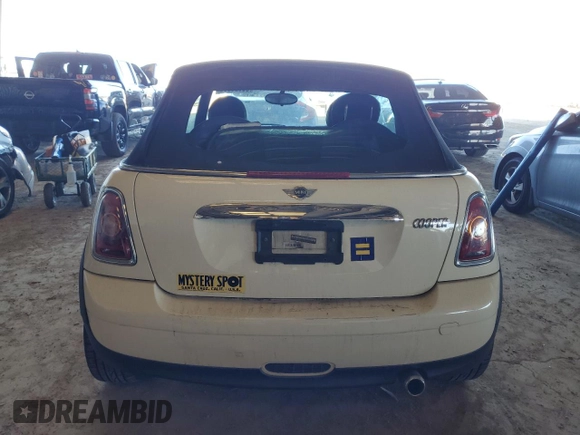 2010 MINI Convertible with VIN WMWMR3C59ATU98390, listed as a Copart auction lot 88820365 with 93,029 mi miles and Clean Title. Bid and sale history available at DreamBid. Image 6.