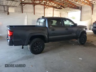2023 Toyota Tacoma SR z VIN 3TMCZ5AN4PM599664, wystawiony jako Copart lot #57462455 z przebiegiem 65 736 mil mil oraz Szkoda całkowita • Salvage title. Historia ofert i sprzedaży dostępna na DreamBid. Obrazek 3.