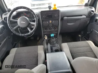 2007 Jeep Wrangler Unlimited X with VIN 1J4GA39117L119395, listed as a Copart auction lot 52588055 with 160,335 mi miles and Salvage title. Bid and sale history available at DreamBid. Image 8.