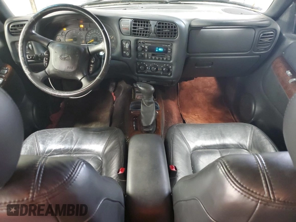2001 Oldsmobile Bravada z VIN 1GHDT13W212196750, wystawiony jako Copart lot #44019065 z przebiegiem 126 878 mil mil oraz Szkody całkowita. Historia ofert i sprzedaży dostępna na DreamBid. Obrazek 8.