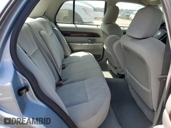 2005 Mercury Grand Marquis GS z VIN 2MEFM74W45X611002, wystawiony jako Copart lot #56645615 z przebiegiem 141 059 mil mil oraz Tytuł czysty. Historia ofert i sprzedaży dostępna na DreamBid. Obrazek 10.