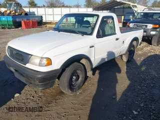 1999 Mazda B-Series 2WD Truck SX with VIN 4F4YR12C2XTM30361, listed as a IAAI auction lot 41439064 with 147,901 mi miles. Bid and sale history available at carsss.com. Image 2.