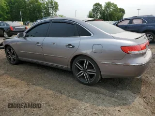2006 Hyundai Azera SE with VIN KMHFC46F46A105028, listed as a Copart auction lot 59569815 with 219,201 mi miles and Salvage title. Bid and sale history available at DreamBid. Image 2.