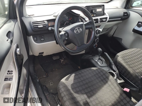 2012 Scion iQ with VIN JTNJJXB03CJ015321, listed as a Copart auction lot 54332355 with 63,439 mi miles and Salvage title. Bid and sale history available at DreamBid. Image 8.