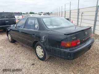 1996 Toyota Camry DX with VIN 4T1BG12K6TU754392, listed as a IAAI auction lot 42013697 with 172,410 mi miles. Bid and sale history available at carsss.com. Image 3.