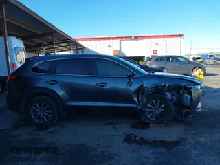 2018 Mazda CX-9 Sport z VIN JM3TCABY8J0203093, wystawiony jako IAAI lot #41218241 z przebiegiem 130 832 mil mil oraz . Historia ofert i sprzedaży dostępna na DreamBid. Obrazek 14.