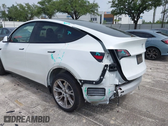 2023 Tesla Model Y Long Range z VIN 7SAYGDEE0PA065534, wystawiony jako IAAI lot #42445868 z przebiegiem 22 638 mil mil oraz . Historia ofert i sprzedaży dostępna na DreamBid. Obrazek 21.