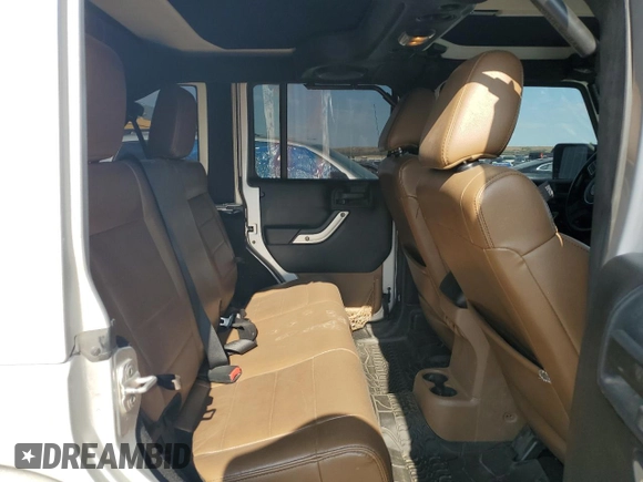 2012 Jeep Wrangler Unlimited Sahara z VIN 1C4HJWEG4CL159731, wystawiony jako Copart lot #59968695 z przebiegiem 111 918 mil mil oraz Szkoda całkowita • Salvage title. Historia ofert i sprzedaży dostępna na DreamBid. Obrazek 10.