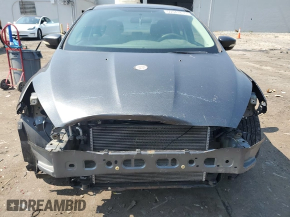 2017 Ford Focus SE with VIN 1FADP3F25HL202470, listed as a Copart auction lot 59941835 with 142,628 mi miles and Salvage title. Bid and sale history available at DreamBid. Image 5.