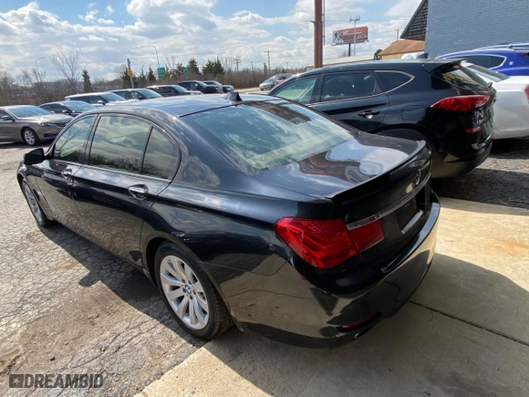 2012 BMW 7 Series 740Li with VIN WBAKB4C55CC576166, listed as a Copart auction lot 52448115 with 154,949 mi miles and Clean Title. Bid and sale history available at carsss.com. Image 3.
