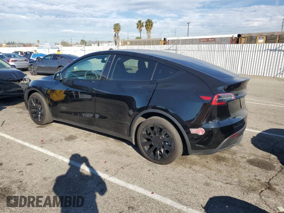 2024 Tesla Model Y Long Range z VIN 7SAYGAEE2RF075681, wystawiony jako Copart lot #86433524 z przebiegiem 18 640 mil mil oraz Szkoda całkowita • Salvage title. Historia ofert i sprzedaży dostępna na DreamBid. Obrazek 2.