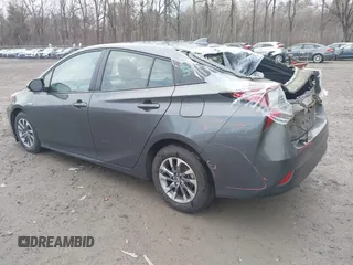 2019 Toyota Prius L Eco z VIN JTDKARFU7K3077941, wystawiony jako IAAI lot #41865759 z przebiegiem 254 612 mil mil oraz . Historia ofert i sprzedaży dostępna na DreamBid. Obrazek 3.