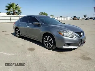 2016 Nissan Altima SR z VIN 1N4AL3AP5GC209029, wystawiony jako Copart lot #55973955 z przebiegiem 131 909 mil mil oraz Szkoda całkowita • Salvage title. Historia ofert i sprzedaży dostępna na DreamBid. Obrazek 13.