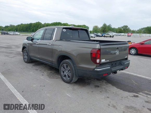 2020 Honda Ridgeline RTL-E with VIN 5FPYK3F78LB001882, listed as a IAAI auction lot 42352980 with 63,278 mi miles and . Bid and sale history available at DreamBid. Image 3.