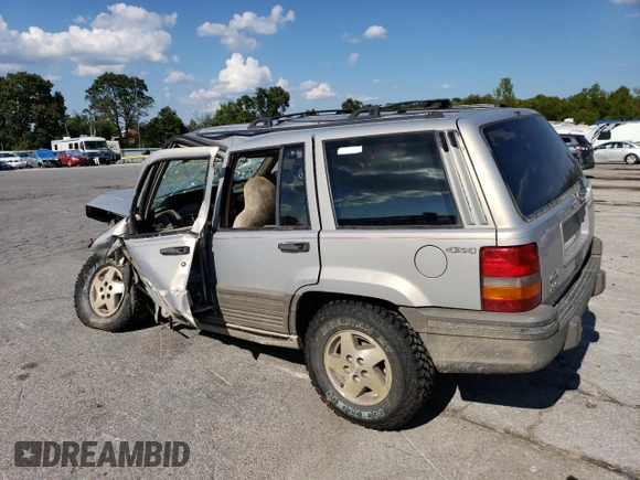 1994 Jeep Grand Cherokee Laredo z VIN 1J4GZ58S5RC328902, wystawiony jako Copart lot #70150474 z przebiegiem 195 604 mil mil oraz Szkoda całkowita • Salvage title. Historia ofert i sprzedaży dostępna na DreamBid. Obrazek 2.