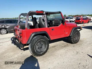 1999 Jeep Wrangler SE with VIN 1J4FY29P8XP483909, listed as a Copart auction lot 48679555 with 168,708 mi miles and Salvage title. Bid and sale history available at DreamBid. Image 3.