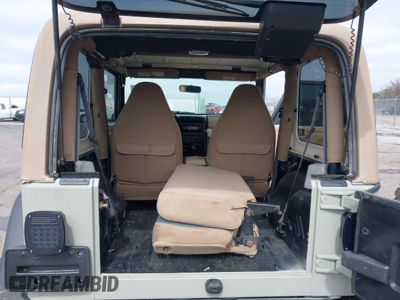 1999 Jeep Wrangler Sahara with VIN 1J4FY49S0XP480017, listed as a IAAI auction lot 41642577 with 154,068 mi miles. Bid and sale history available at carsss.com. Image 8.