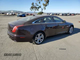 2014 Jaguar XJ with VIN SAJWA1CZ3E8V69877, listed as a Copart auction lot 48159005 with 57,567 mi miles and Clean Title. Bid and sale history available at DreamBid. Image 3.