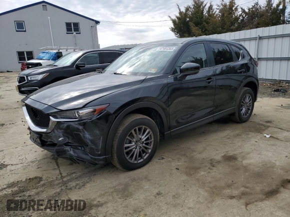 2017 Mazda CX-5 Touring with VIN JM3KFACLXH0195725, listed as a Copart auction lot 47464365 with 65,457 mi miles and Salvage Title. Bid and sale history available at carsss.com. Image 1.