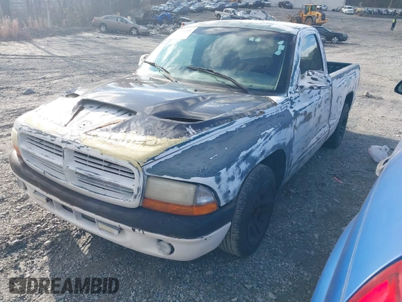 1998 Dodge Dakota SLT z VIN 1B7FL26X7WS586596, wystawiony jako IAAI lot #41745358 z przebiegiem 173 950 mil mil oraz . Historia ofert i sprzedaży dostępna na DreamBid. Obrazek 2.