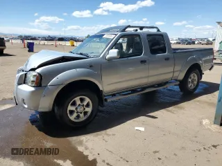 2003 Nissan Frontier SE z VIN 1N6ED29XX3C431323, wystawiony jako Copart lot #58008965 z przebiegiem 69 361 mil mil oraz Szkoda całkowita • Salvage title. Historia ofert i sprzedaży dostępna na DreamBid. Obrazek 1.