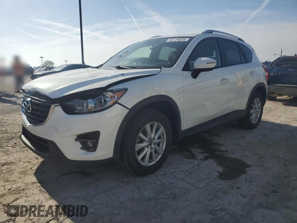 2016 Mazda CX-5 Touring z VIN JM3KE2CYXG0683673, wystawiony jako Copart lot #56724025 z przebiegiem 107 293 mil mil oraz Szkoda całkowita • Salvage title. Historia ofert i sprzedaży dostępna na DreamBid. Obrazek 1.