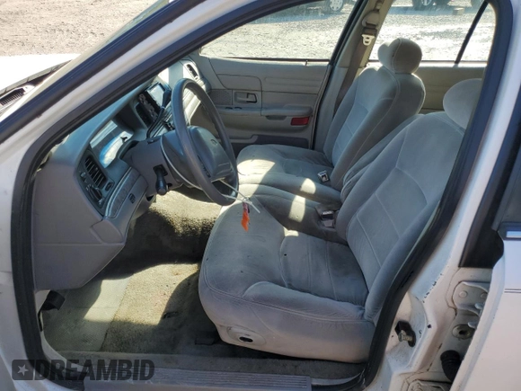 2000 Ford Crown Victoria LX z VIN 2FAFP74W0YX125595, wystawiony jako Copart lot #84675434 z przebiegiem 151 438 mil mil oraz Szkoda całkowita • Salvage title. Historia ofert i sprzedaży dostępna na DreamBid. Obrazek 7.
