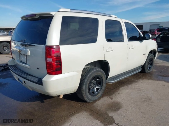 2012 Chevrolet Tahoe Commercial with VIN 1GNLC2E0XCR185593, listed as a IAAI auction lot 41217784 with 150,419 mi miles. Bid and sale history available at carsss.com. Image 4.