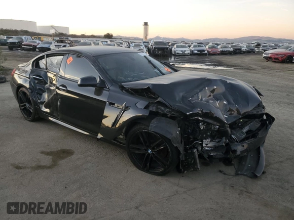 2015 BMW 6 Series 640i z VIN WBA6A0C59FD318390, wystawiony jako Copart lot #87831165 z przebiegiem Nie podano mil oraz Szkoda całkowita • Salvage title. Historia ofert i sprzedaży dostępna na DreamBid. Obrazek 4.