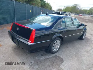 2009 Cadillac DTS 1SC z VIN 1G6KD57Y29U141800, wystawiony jako IAAI lot #42190874 z przebiegiem 115 043 mil mil oraz . Historia ofert i sprzedaży dostępna na DreamBid. Obrazek 4.