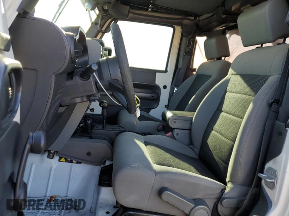 2010 Jeep Wrangler Sport with VIN 1J4AA2D16AL144842, listed as a Copart auction lot 50173535 with 106,000 mi miles and Salvage Title. Bid and sale history available at carsss.com. Image 7.