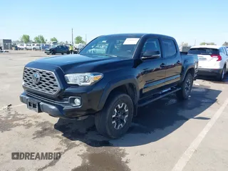 2021 Toyota Tacoma SR z VIN 3TMCZ5AN3MM421868, wystawiony jako IAAI lot #42003665 z przebiegiem 39 380 mil mil oraz . Historia ofert i sprzedaży dostępna na DreamBid. Obrazek 2.