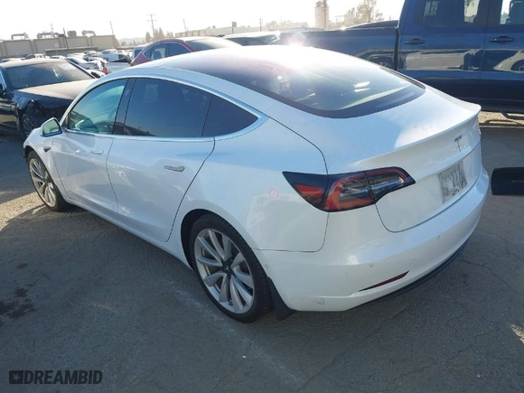 2018 Tesla Model 3 Long Range Battery with VIN 5YJ3E1EA6JF042844, listed as a IAAI auction lot 41349172 with 122,851 mi miles. Bid and sale history available at carsss.com. Image 3.