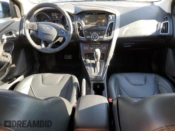2018 Ford Focus Titanium z VIN 1FADP3N2XJL297048, wystawiony jako Copart lot #61579925 z przebiegiem 68 774 mil mil oraz Szkoda całkowita • Salvage title. Historia ofert i sprzedaży dostępna na DreamBid. Obrazek 8.