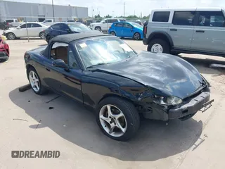 2002 Mazda MX-5 Miata Cloth with VIN JM1NB353520221312, listed as a IAAI auction lot 42410028 with 99,375 mi miles and . Bid and sale history available at DreamBid. Image 1.