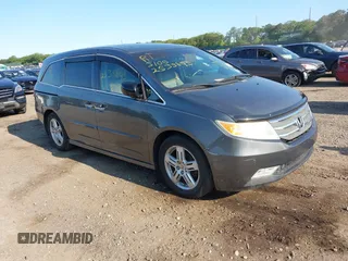 2011 Honda Odyssey Touring with VIN 5FNRL5H92BB027333, listed as a IAAI auction lot 42415151 with Not provided miles and . Bid and sale history available at DreamBid. Image 1.