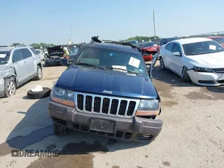 2000 Jeep Grand Cherokee Laredo with VIN 1J4G248S5YC413977, listed as a IAAI auction lot 42045808 with Not provided miles and . Bid and sale history available at DreamBid. Image 12.