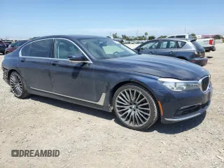 2018 BMW 7 Series 740i with VIN WBA7E2C58JG743126, listed as a Copart auction lot 53843795 with 90,614 mi miles and Salvage title. Bid and sale history available at DreamBid. Image 4.