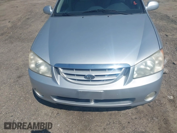 2004 Kia Spectra LX with VIN KNAFE122145037581, listed as a IAAI auction lot 41965681 with 49,817 mi miles. Bid and sale history available at carsss.com. Image 6.