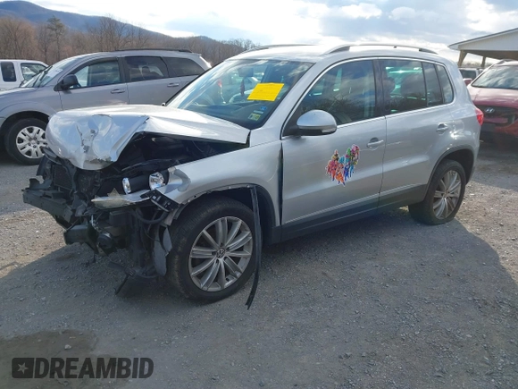 2012 Volkswagen Tiguan SE with VIN WVGAV7AX2CW543003, listed as a IAAI auction lot 41803970 with 187,639 mi miles and . Bid and sale history available at DreamBid. Image 2.