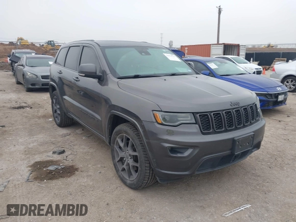2021 Jeep Grand Cherokee 80th Anniversary z VIN 1C4RJFBGXMC621817, wystawiony jako IAAI lot #41519733 z przebiegiem 60 552 mil mil oraz . Historia ofert i sprzedaży dostępna na DreamBid. Obrazek 1.