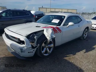 2014 Dodge Challenger R/T with VIN 2C3CDYBT6EH185590, listed as a IAAI auction lot 42536813 with 198,854 mi miles and . Bid and sale history available at DreamBid. Image 17.
