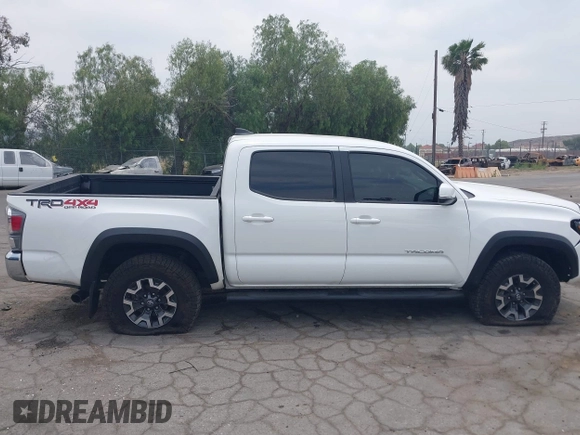 2023 Toyota Tacoma SR with VIN 3TMCZ5AN1PM556299, listed as a IAAI auction lot 42344160 with 42,338 mi miles and . Bid and sale history available at DreamBid. Image 14.