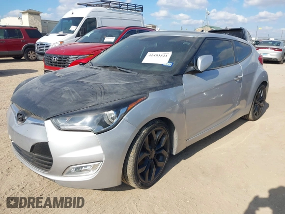 2012 Hyundai Veloster w/Gray Int with VIN KMHTC6AD0CU068400, listed as a IAAI auction lot 41493521 with 72,682 mi miles and . Bid and sale history available at DreamBid. Image 2.